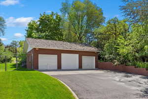 Garage featuring a yard