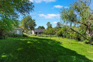 View of yard with a playground