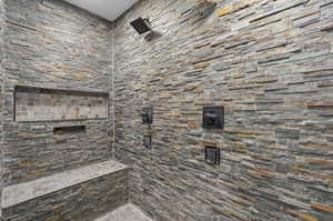 Bathroom featuring tiled shower