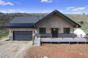 View of front of home featuring a garage