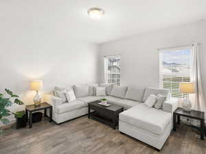 Living room with hardwood / wood-style flooring