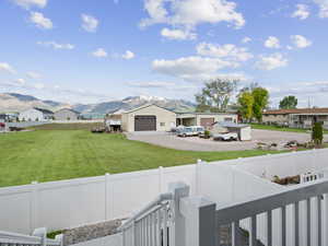 Exterior space featuring a garage and a mountain view