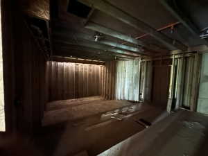 Theater room under suspended slab garage