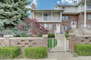 View of front of house featuring a balcony