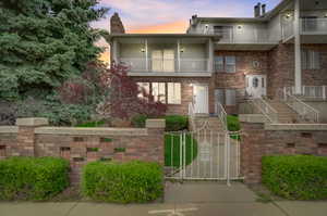 View of front of property with a balcony