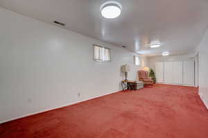 Unfurnished room with carpet