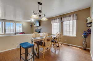 Dining space with wood-type flooring