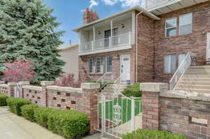 View of front of house featuring a balcony