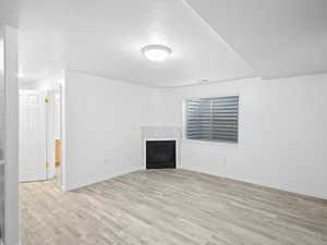 Unfurnished living room featuring light hardwood / wood-style flooring