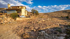 View of yard featuring a mountain view and a balcony