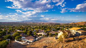 Birds eye view of property with a mountain view