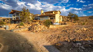 View of front of home featuring a balcony