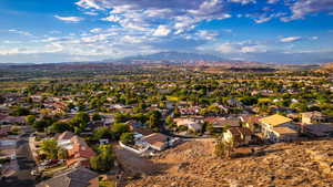 Birds eye view of property with a mountain view