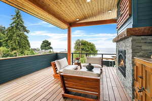 EXAMPLE Of  Deck featuring an outdoor living space and a water view