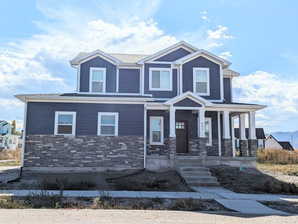 View of front of house featuring covered porch