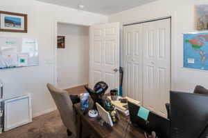 View of carpeted home office