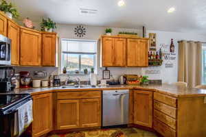 Kitchen with stainless steel appliances and sink