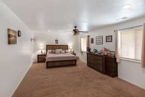 Bedroom featuring carpet and ceiling fan