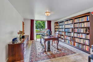 Main floor office with built in shelves