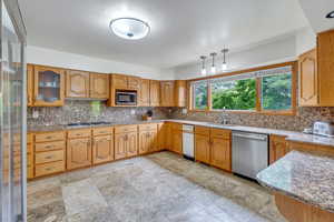 Stainless appliances and new tile in kitchen