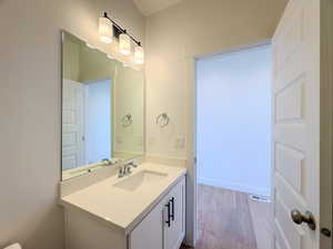 Bathroom featuring vanity and hardwood / wood-style flooring