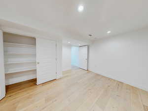 Unfurnished bedroom with light hardwood / wood-style floors