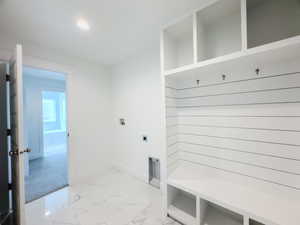 Mudroom with light tile patterned floors