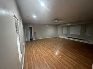 Spare room with ceiling fan and light wood-type flooring