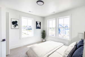 Upper guest room 2, home is to be built pictures are of home with similar finish and virtually staged