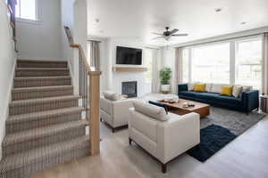 Great room and upper stairs  home is to be built pictures are of home with similar finish and virtually staged