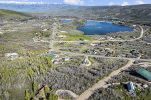 Bird's eye view featuring a water and mountain view