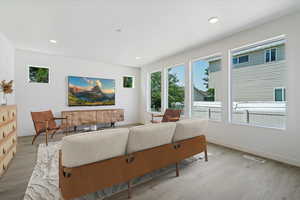 Living room with light hardwood / wood-style flooring