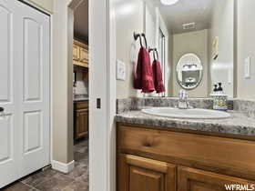 Bathroom featuring vanity and tile floors