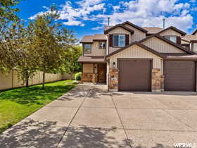 View of front of property with a garage