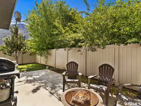 View of patio featuring a fire pit