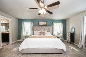 Carpeted bedroom with onsuite bathroom