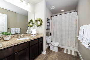 Full bathroom with tile floor