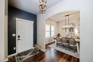 Foyer with dark hardwood