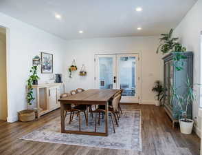 Dining area featuring dark hardwood / wood-style floors and french doors