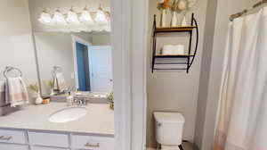 Upper floor full bathroom with separate toilet and shower from vanity area