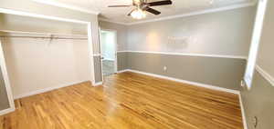 Unfurnished bedroom with crown molding, a textured ceiling, light hardwood / wood flooring, a closet, and ceiling fan