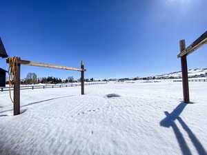 View of yard covered in snow