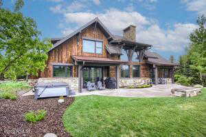 Back of house featuring a patio and a yard