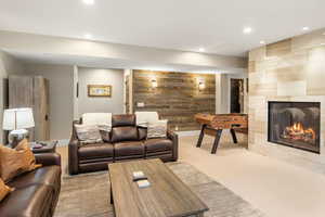 Carpeted living room featuring a fireplace