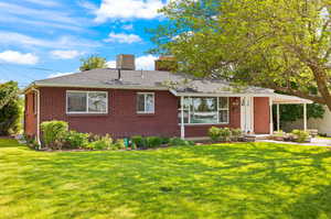 Single story home featuring a front yard