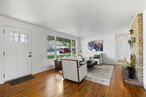 Living room featuring dark wood-type flooring