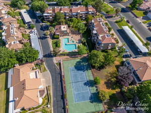 Drone view of pickleball/tennis courts and pool