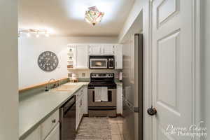 Kitchen with newer dishwasher. Fridge included.