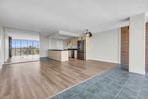 Open-concept kitchen and living room area.