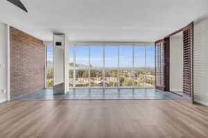 South facing, floor to ceiling windows, provide for natural  light. Original balcony was enclosed adding to the livable space of this condo.